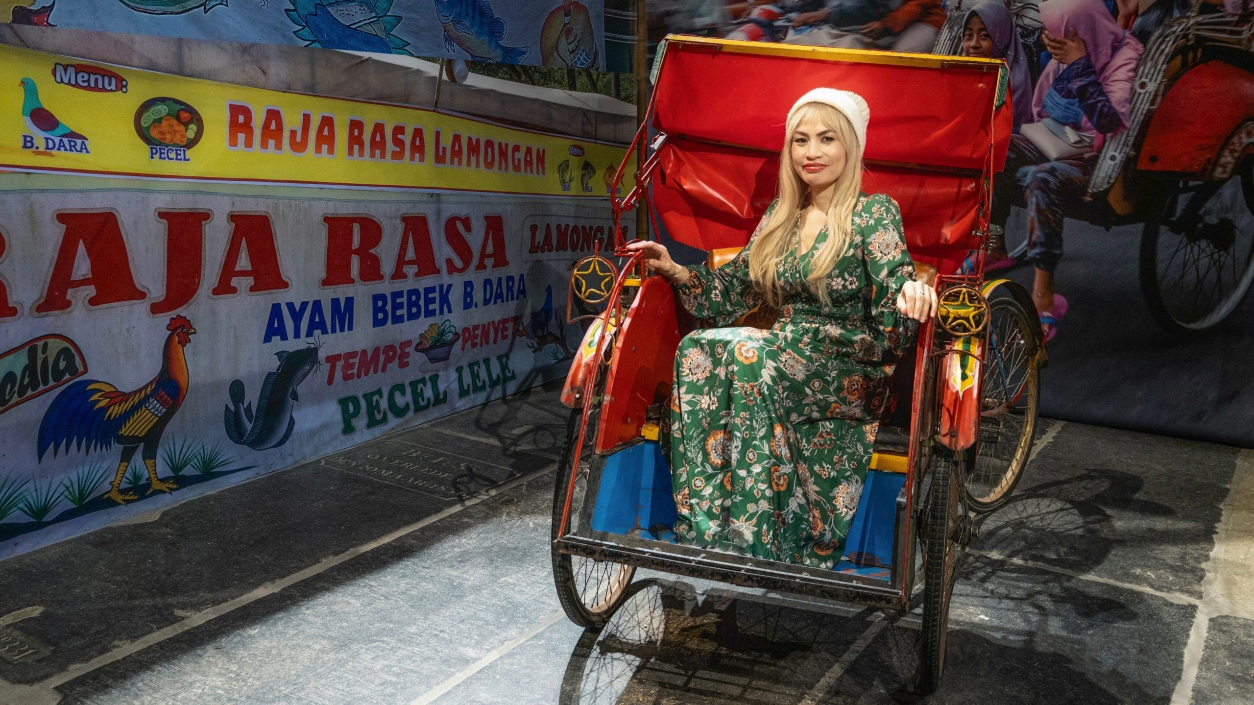 With the becak.